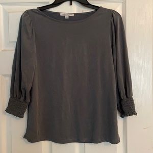 Dark gray shirt with elastic at bottom of sleeve